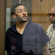 Former NFL football player Kellen Winslow Jr. looks through protective glass during his arraignment June 15, 2018, in Vista, Calif. The former tight end was arrested Thursday on charges of rape and other sex crimes, the day he was to appear in court on an unrelated burglary charge.